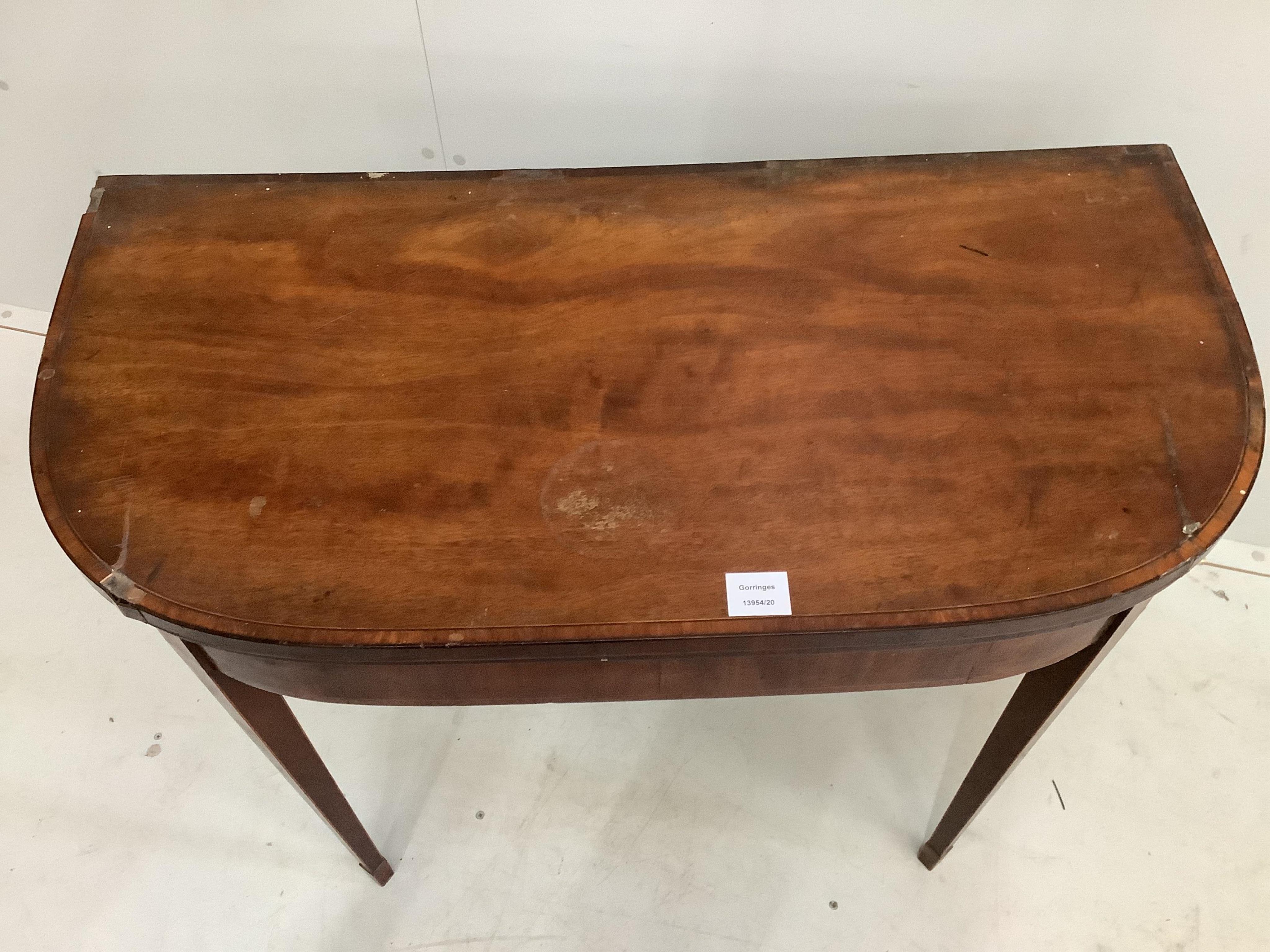 A George III satinwood banded mahogany D shaped folding card table, width 92cm, depth 45cm, height 74cm